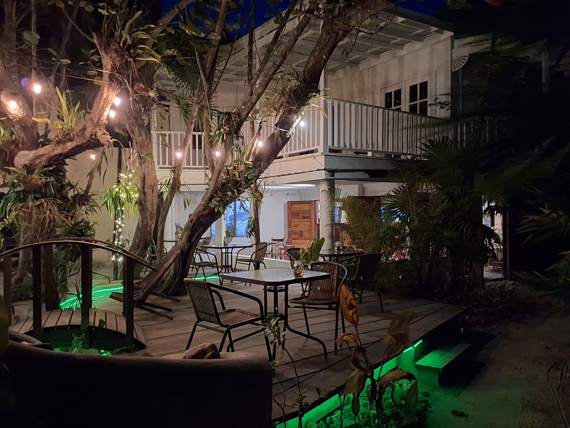 Suggestion Gourmet tropical dining terrace and mixed-use building at night